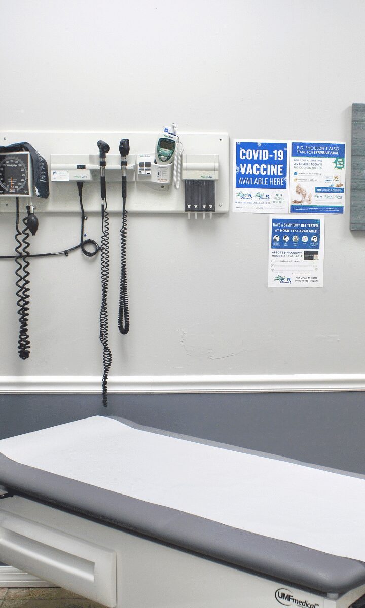 Medical exam room with COVID-19 posters