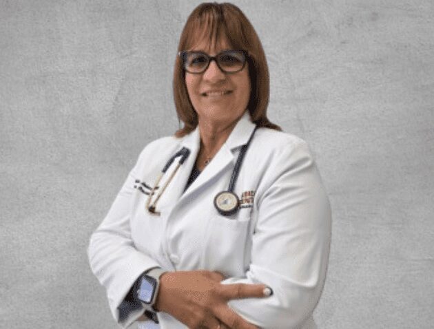 Doctor in white coat with arms crossed