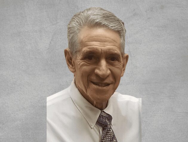 Smiling elderly man in shirt and tie